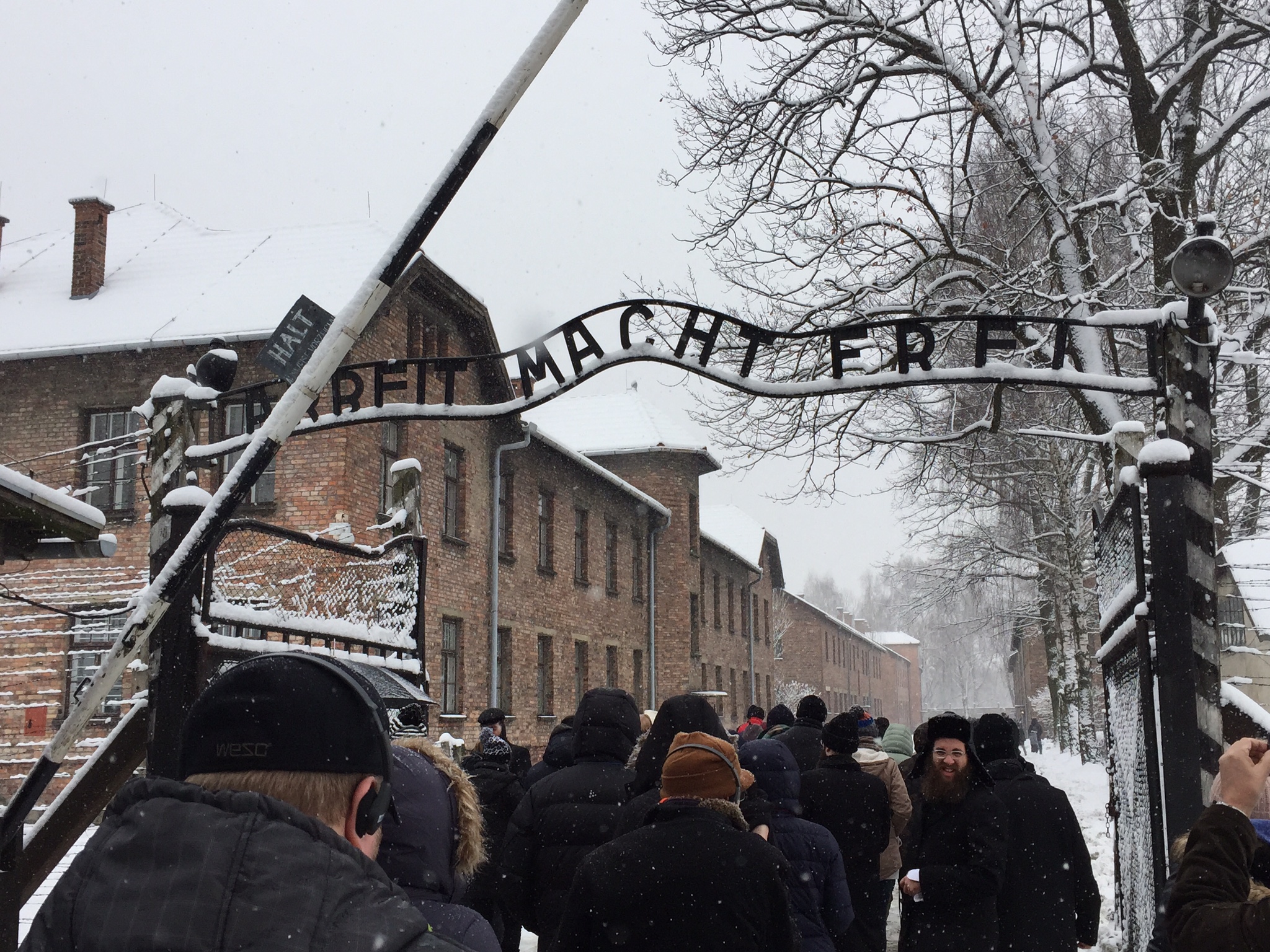 Our tour group walks underneath the infamous gate at Auschwitz I. 