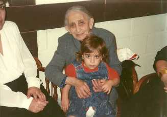 Photo above: Armanush and her husband Armenian Genocide survivor Manuk with grandson Manuk. Photo below: Armanush holding grandson Manuk on her lap.