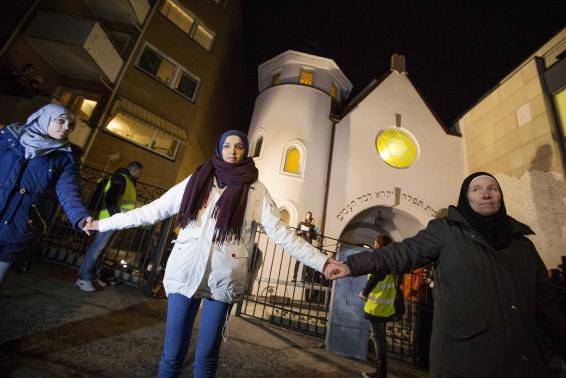 Muslims in Norway form protective ring outside a synagogue in Oslo on Feb. 21, 2014. Photo Credit: REUTERS/Hakon Mosvold Larsen/NTB Scanpix