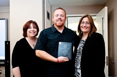 With Sherry Bard, Project Director of Educational Programs (left) and Sheila Hansen, Senior Trainer and Content Specialist (right), Jonathan Owens, a teacher at Valhalla High School in San Diego, proudly displays his award. (2010) (Photo Kim Fox)