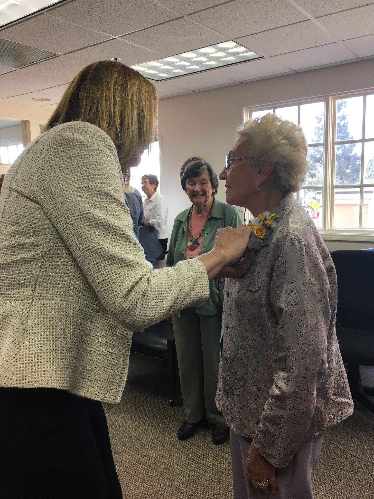 Assemblymember Jacqui Irwin honors Holocaust surivovr Celina Biniaz.