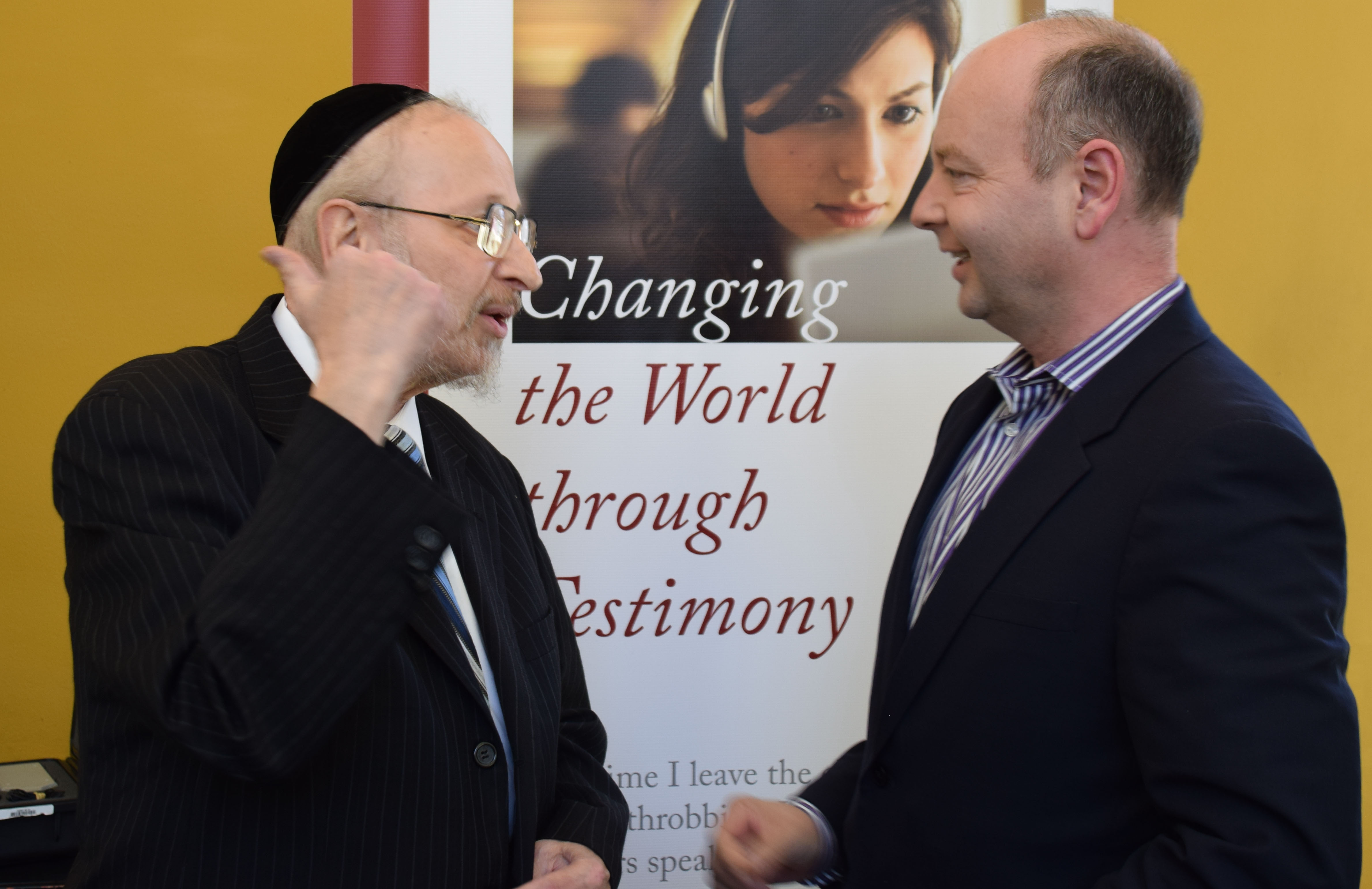 Harry Reicher speaking with Stephen Smith at Reicher’s public lecture in July 2014. 