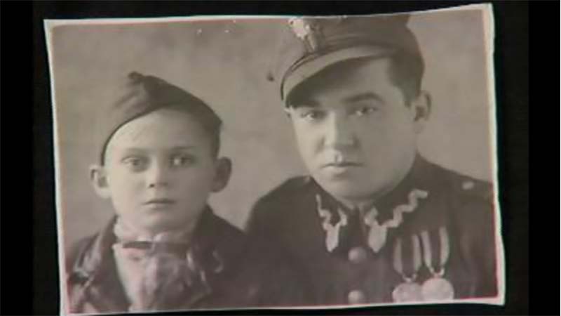 11-year-old Thomas Buergenthal (left) with a Polish soldier (right) after liberation from Sachsenhausen.