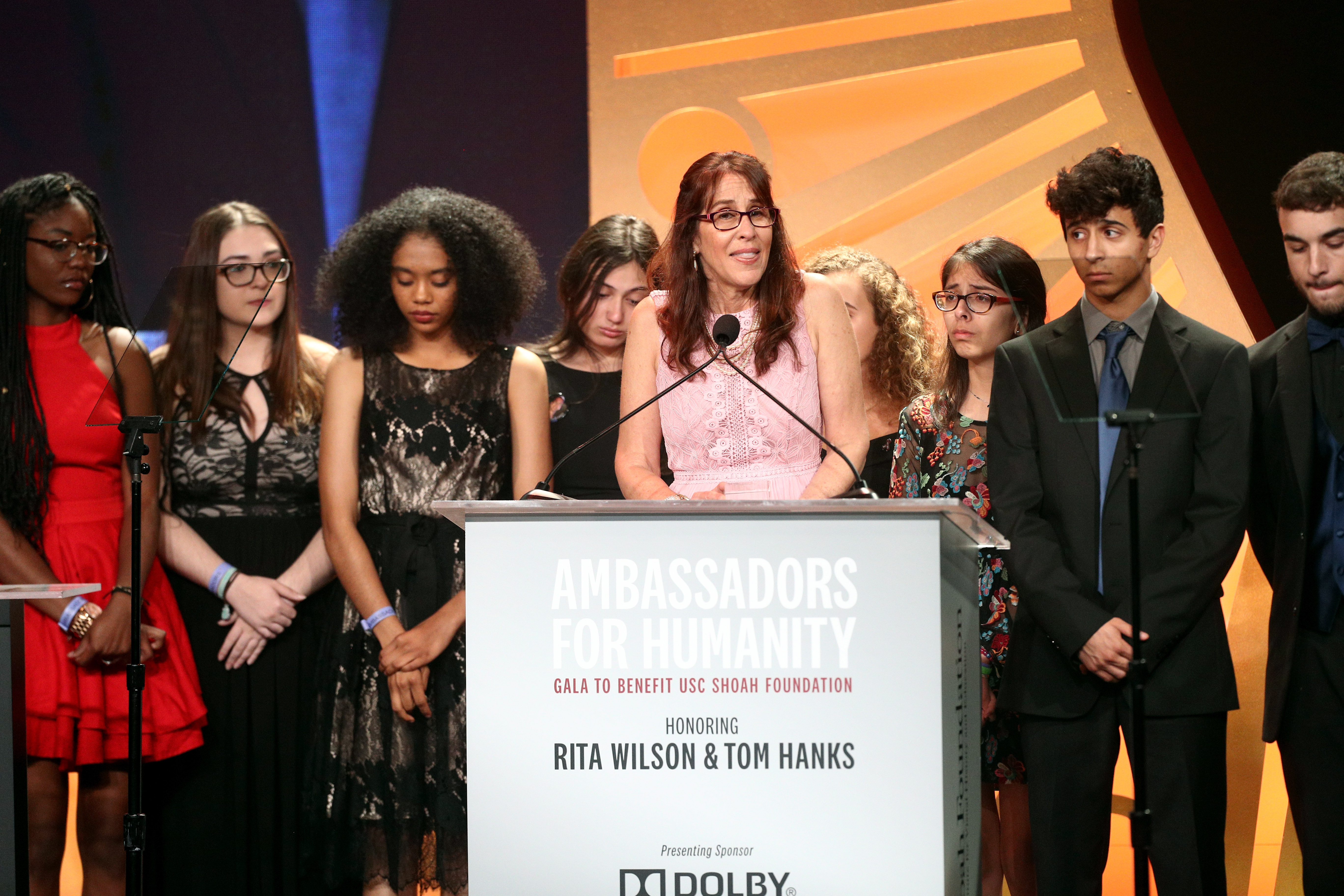 With her students in the backdrop, Marjory Stoneman Douglas teacher Ivy Schamis speaks at USC Shoah Foundation's gala in November.