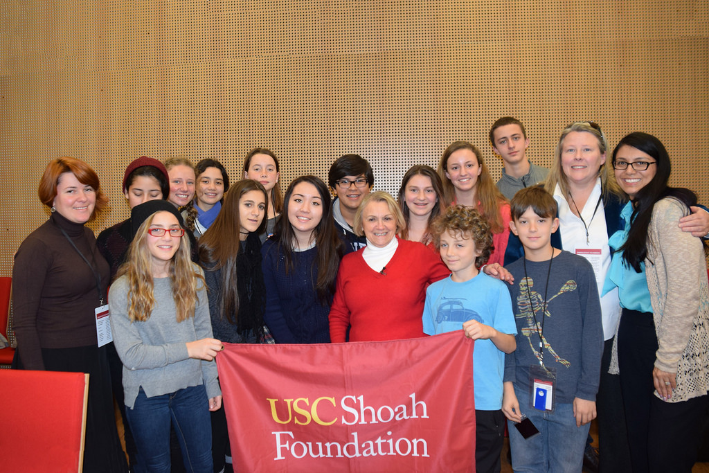 Auschwitz survivor Paula Lebovics, center, shares a lighter moment with students from USC Shoah Foundation’s Junior Intern program and USC Shoah staff members. (USC Photo/Josh Grossberg)