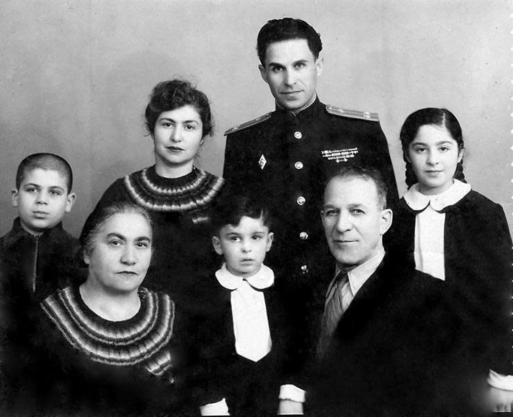 Leonid, standing in uniform, with his wife Esfir, their children Aleksander (center) and Flora. Esfir&#039;s mother Sonja and Leonid&#039;s father Boris also pictured, with Garry (left), Boris&#039; son from a second marriage.