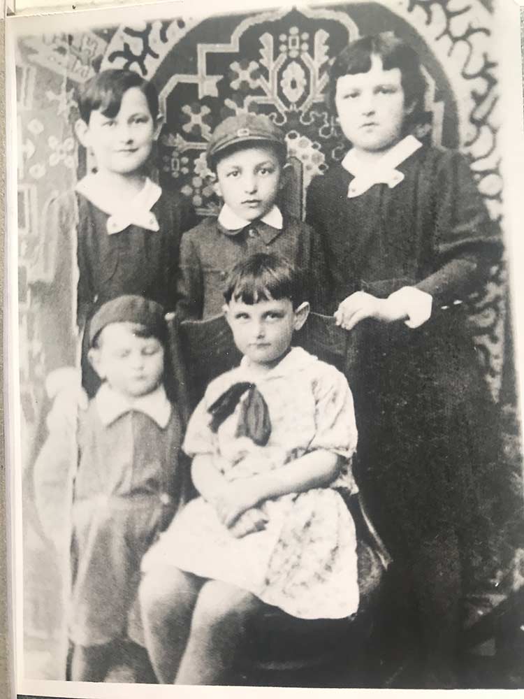The Fink siblings, (top row) Anne, Sol, Sally, (bottom row) Ruth and Eli, in 1932. They grew up with a large, tight-knit family in Sanok, Poland.