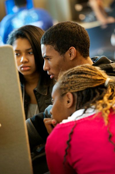 Students watch a testimony online via IWitness.