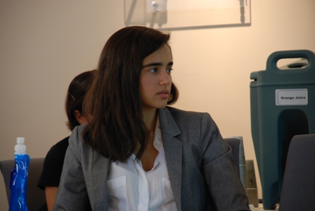 Jasneet Aulakh, a junior majoring in history, English, philosophy, politics, and law, looks on during another student's presentation.  Aulakh's research used personal interviews to debunk the myth that the 1984 anti-Sikh pogroms in India pitted the entire Sikh community against the entire Hindu community.
