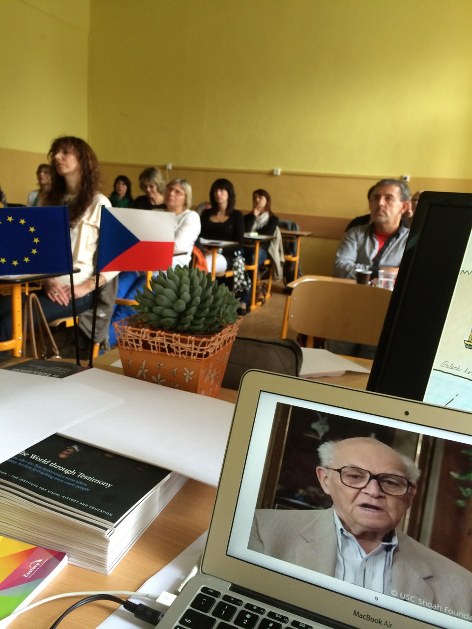 Educators watch testimony of local survivor Viktor Kende at seminar at Gymnázium Česká