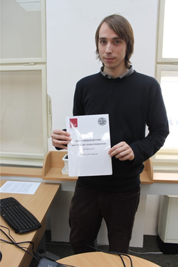 Jakub Mlynář, coordinator of Malach Center for Visual History, holds Czech version of the VHA User Manual.