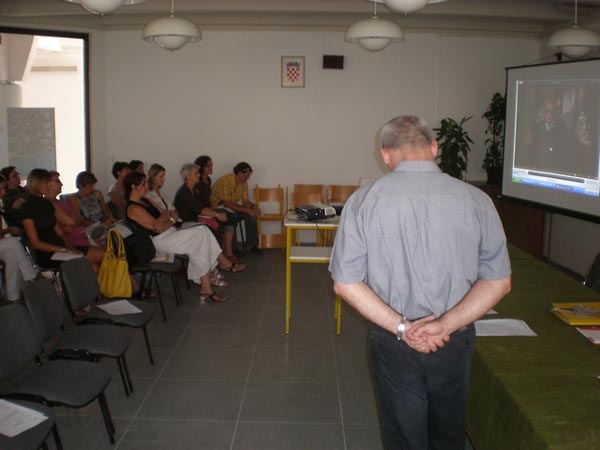 Participants at a teacher training seminar watch testimony during a workshop session led by lesson author Miroslav Šašić.
