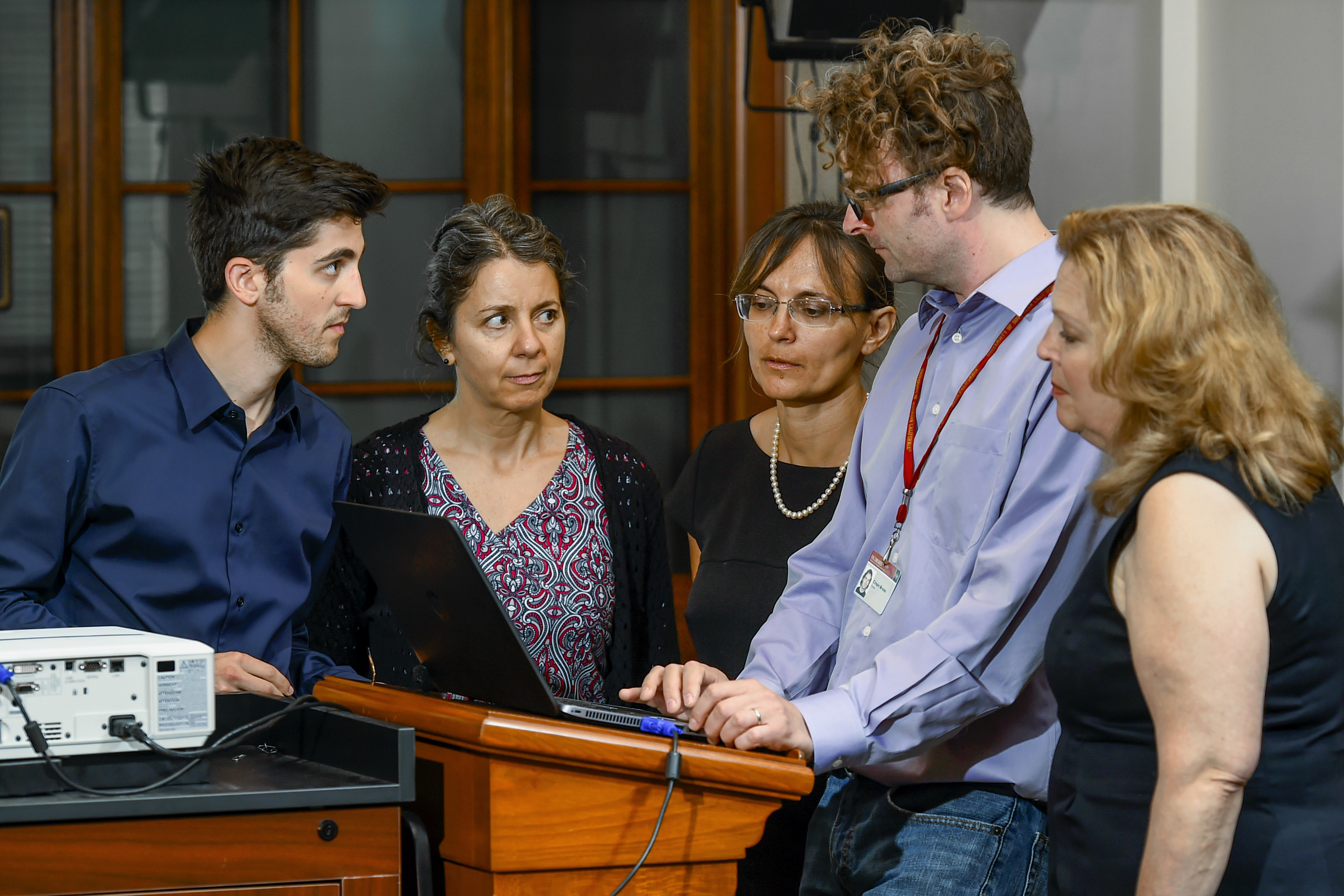 From left: Indexers Zach Albert, Debbie Kahn, Svetlana Ushakova, curator Crispin Brooks and indexer Nancy Saul index the final testimony from the JFCS collection