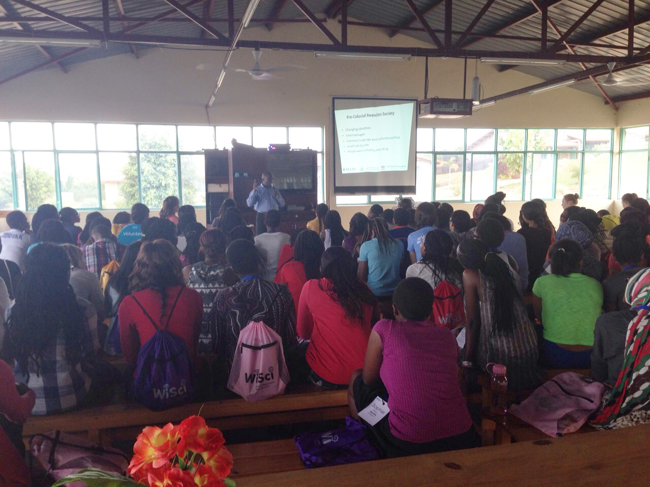 Davis Wamonhi gives a presentation to the camp about Rwandan history and genocide