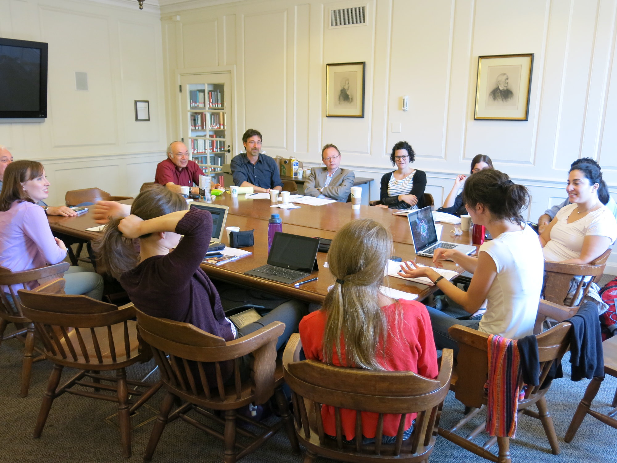 Workshop participants and discussants critique a PhD candidate's dissertation research.
