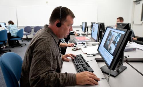 Corey Harbaugh watching testimony during Master Teacher program.. 