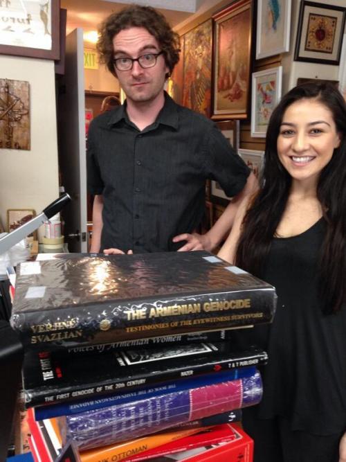 USC Shoah Foundation Curator Crispin Brooks and Syuzanna Petrosyan selecting books on the Armenian Genocide.