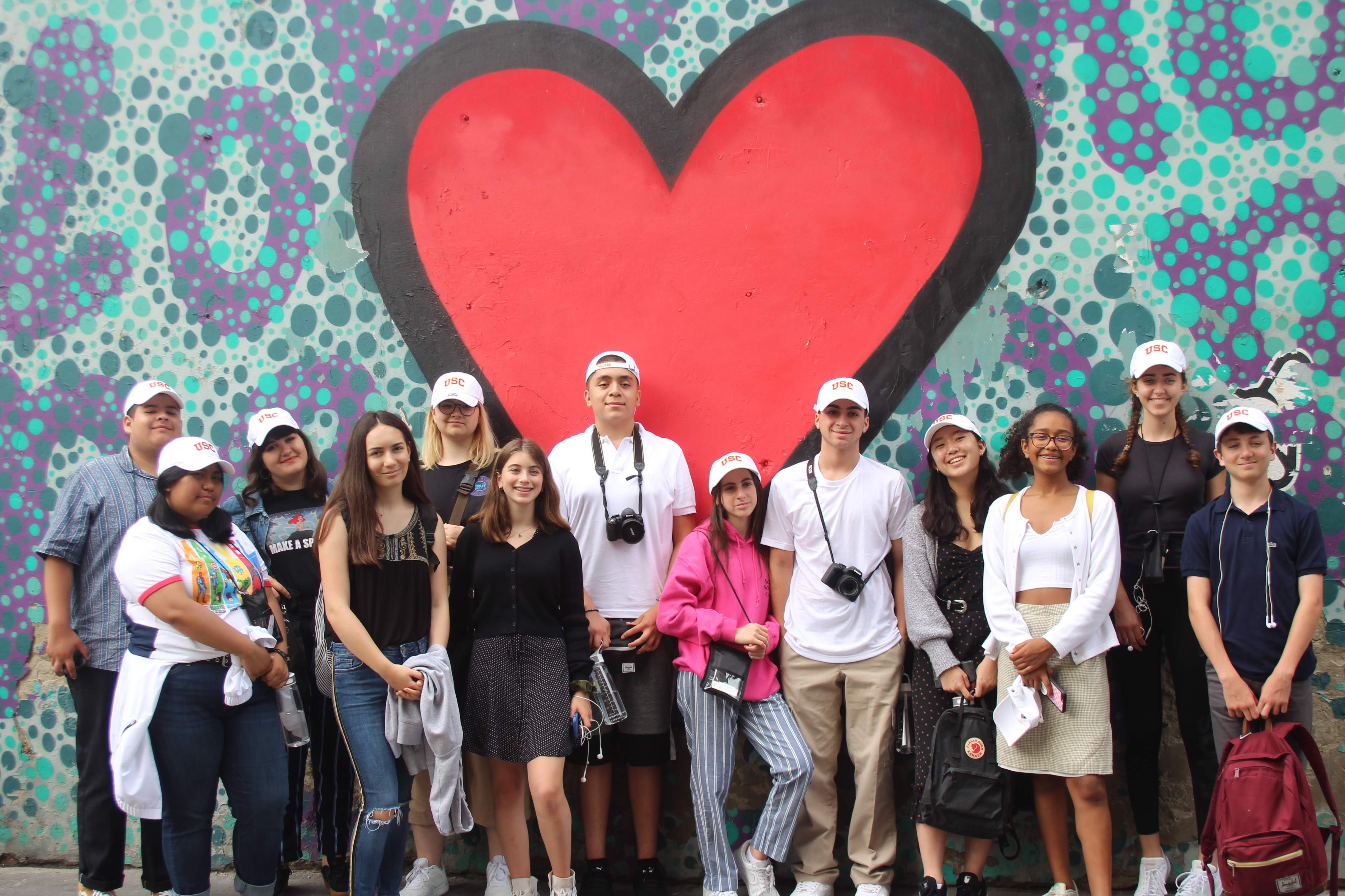&lt;span style=&quot;font-family: Calibri, sans-serif; font-size: 14.6667px;&quot;&gt;The William P. Lauder Junior Interns in Budapest in 2019, in front of a mural in the Jewish quarter that reads “Love Thy Neighbor.”&lt;/span&gt;