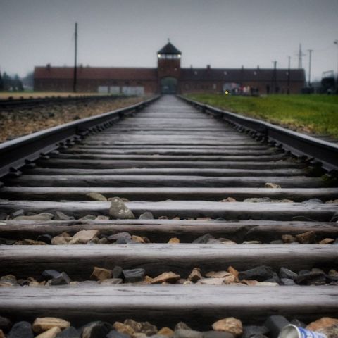The Auschwitz camp is seen at the end of the tracks.