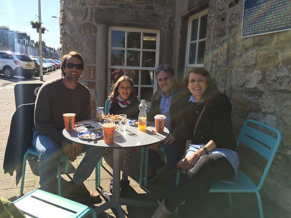 Josh Grossberg (third from left) with Olga and her husband and daughter