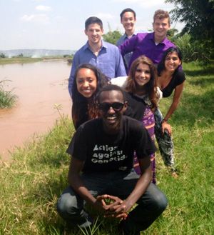 Yannick Tona, front, with the Problems Without Passports class at the Nyabarongo River