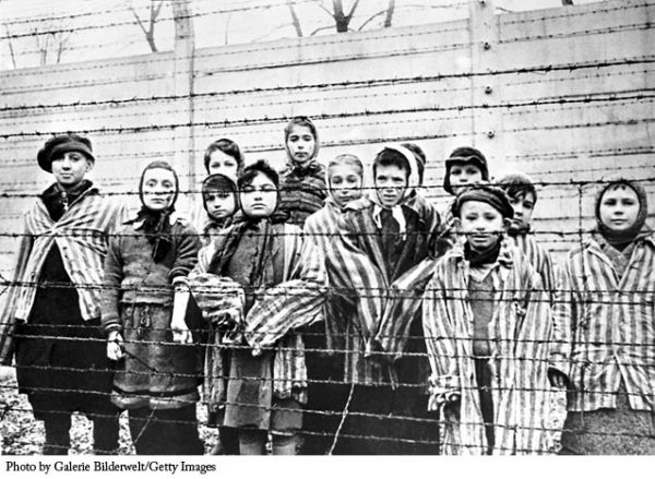 Eva Slonim (the girl wearing the head scarf) composed a poem along with a group of other children while imprisoned in Auschwitz.