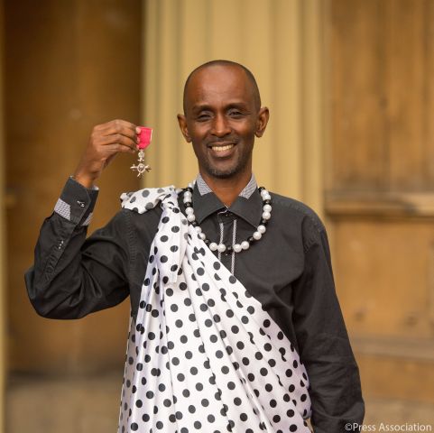 Eric Murangwa receives his MBE Award (Member of the Most Excellent Order of the British Empire) at Buckingham Palace.