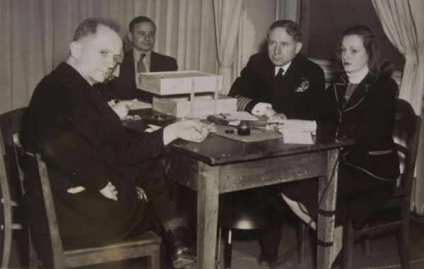 L to R: Defendant Karl Doenitz, who briefly served as Hitler's successor; a translator; Judge Michael A. Musmanno; and Vivien Spitz.