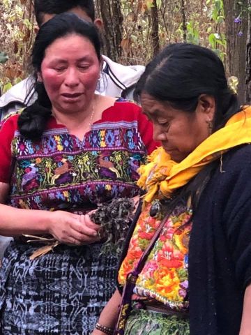 Domitilla (left) shares her heart with Rosalina Tuyuc just before the ceremony in memory of her father.