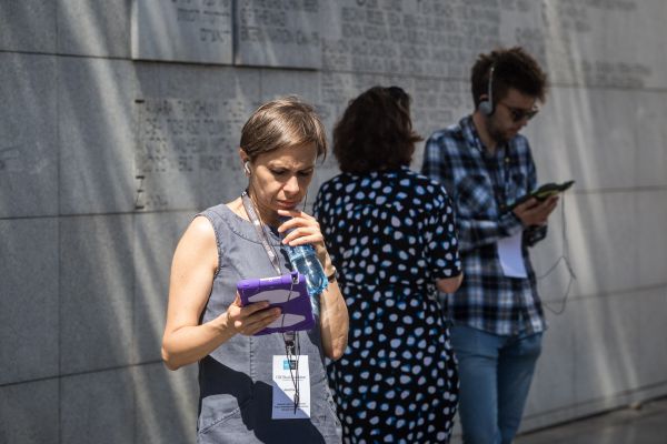 Educators in Poland taking the IWalk tour at the site of the Warsaw ghetto.