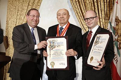 Councilmember Paul Koretz presents certificates to Andew Viterbi, center, and Stephen Smith, right Councilmember Paul Koretz presents certificates to Andew Viterbi, center, and Stephen Smith, right