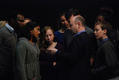 Stephen Smith shows students testimony on his iPhone Stephen Smith shows students testimony on his iPhone