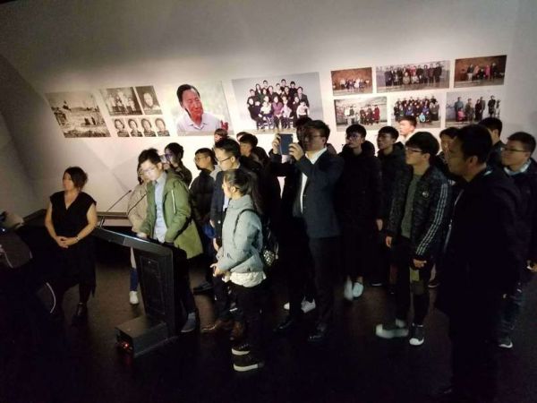 Students gather around as New Dimensions in Testimony Mandarin Project Assistant, Cheng Fang demonstrates interactive testimony, with creator and producer, Heather Maio-Smith, at the Nanjing Massacre Memorial 13 December 2017. Students gather around as New Dimensions in Testimony Mandarin Project Assistant, Cheng Fang demonstrates interactive testimony, with creator and producer, Heather Maio-Smith, at the Nanjing Massacre Memorial 13 December 2017.