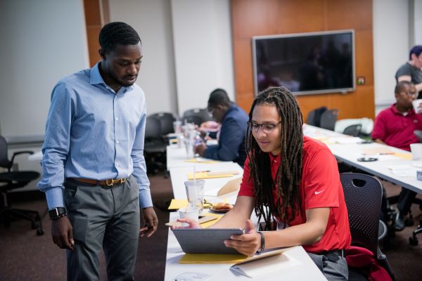 Manasseh Konadu (L), a student at Worcester State University in Massachusetts, works with another student at USC Shoah Foundation's Intercollegiate Diversity Congress Summit in September.